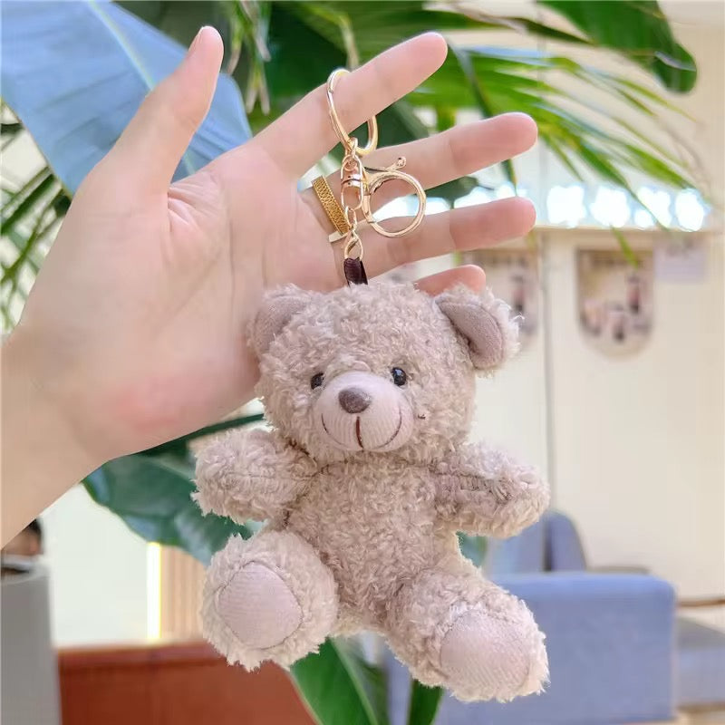 Colorful KIDZPAPA premium keychains featuring unicorn, dinosaur, panda, and other cute designs on a white background.