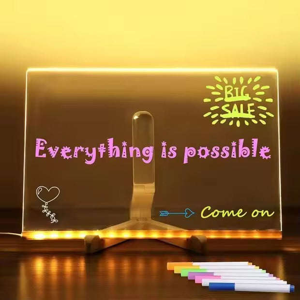 LED acrylic writing board with stand, colorful markers, and removable template from KIDZPAPA, showing vibrant writing on the board.